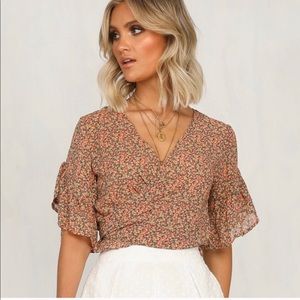 Wrap front flutter sleeve top
